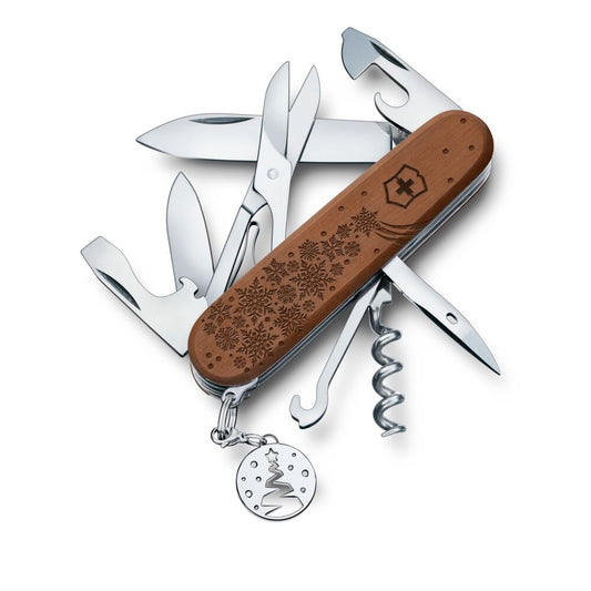 Multitool with wooden handle and metal tools on a white background