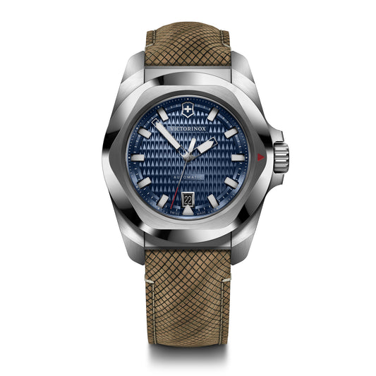 A silver Victorinox watch with a blue dial and a brown textured strap.