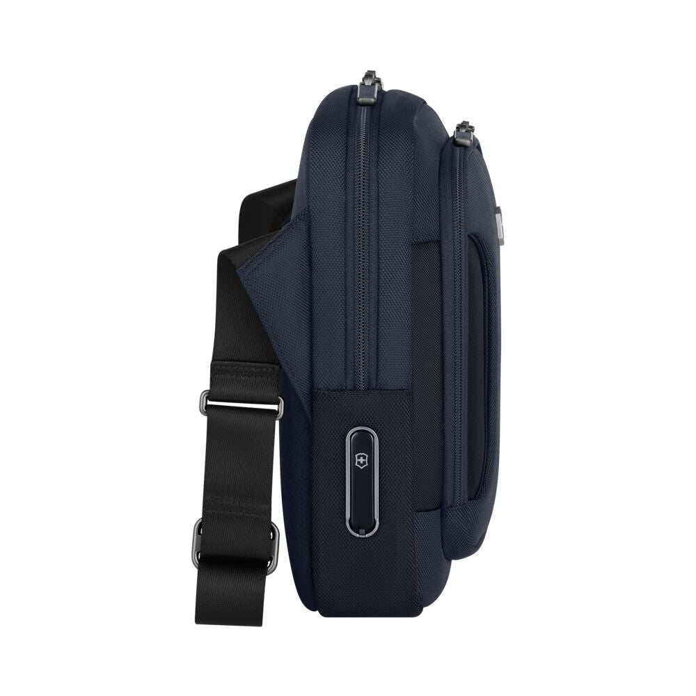 Blue crossbody bag side view with two zippers and adjustable black shoulder strap