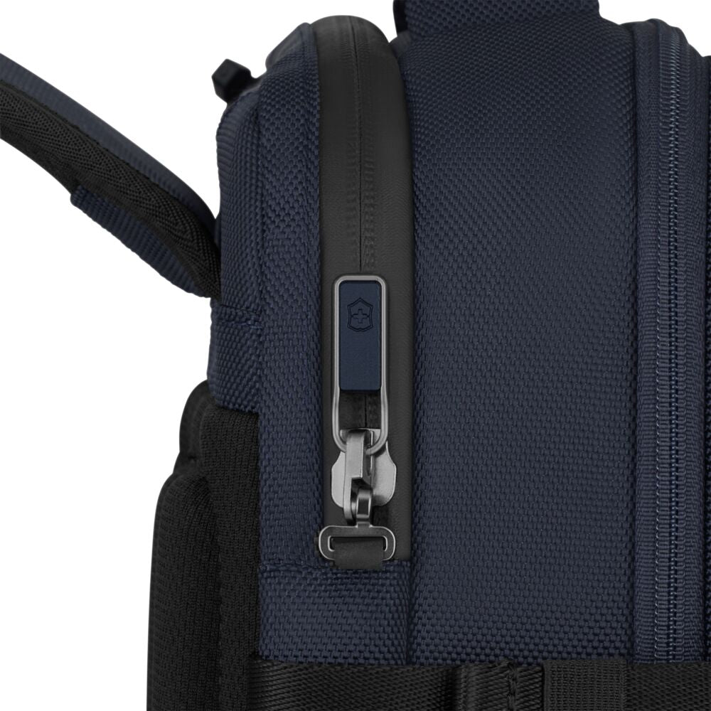Blue backpack side with metal zipper pull and adjustable webbing carry strap