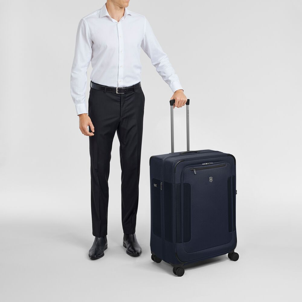 Large wheeled suitcase in navy blue with front pocket and telescoping handle