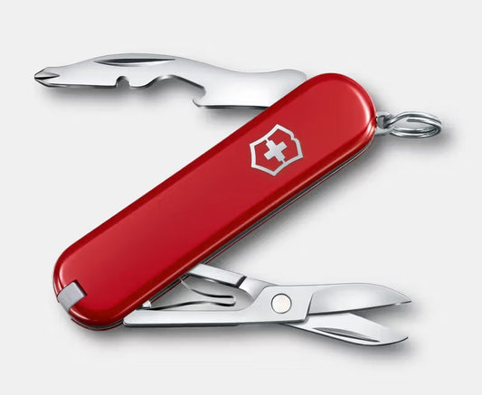 Red Swiss Army knife with multiple tools on a white background